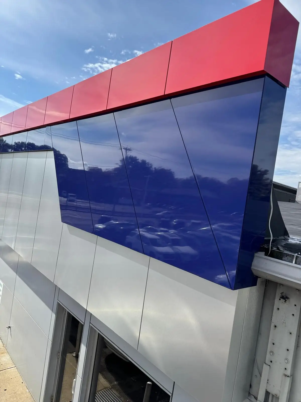 Navy gloss ACM panels with a red ACM band, Framingham