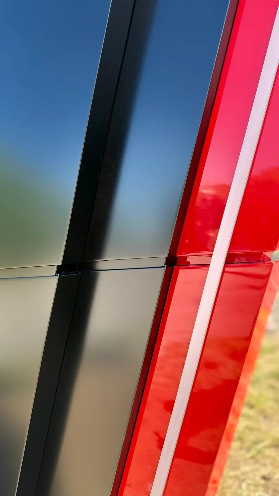 Detail of the black and red ACM totem edge, Framingham
