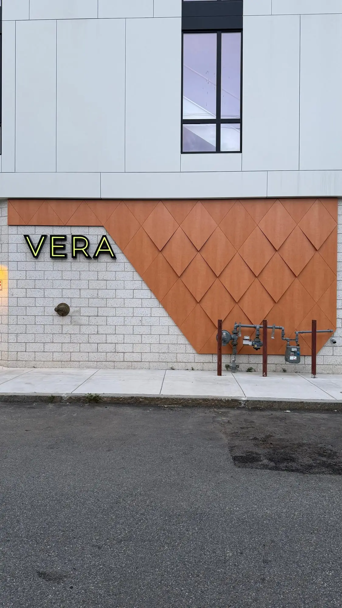 VERA entrance wall clad in wood-look ACM diamond panels, Boston