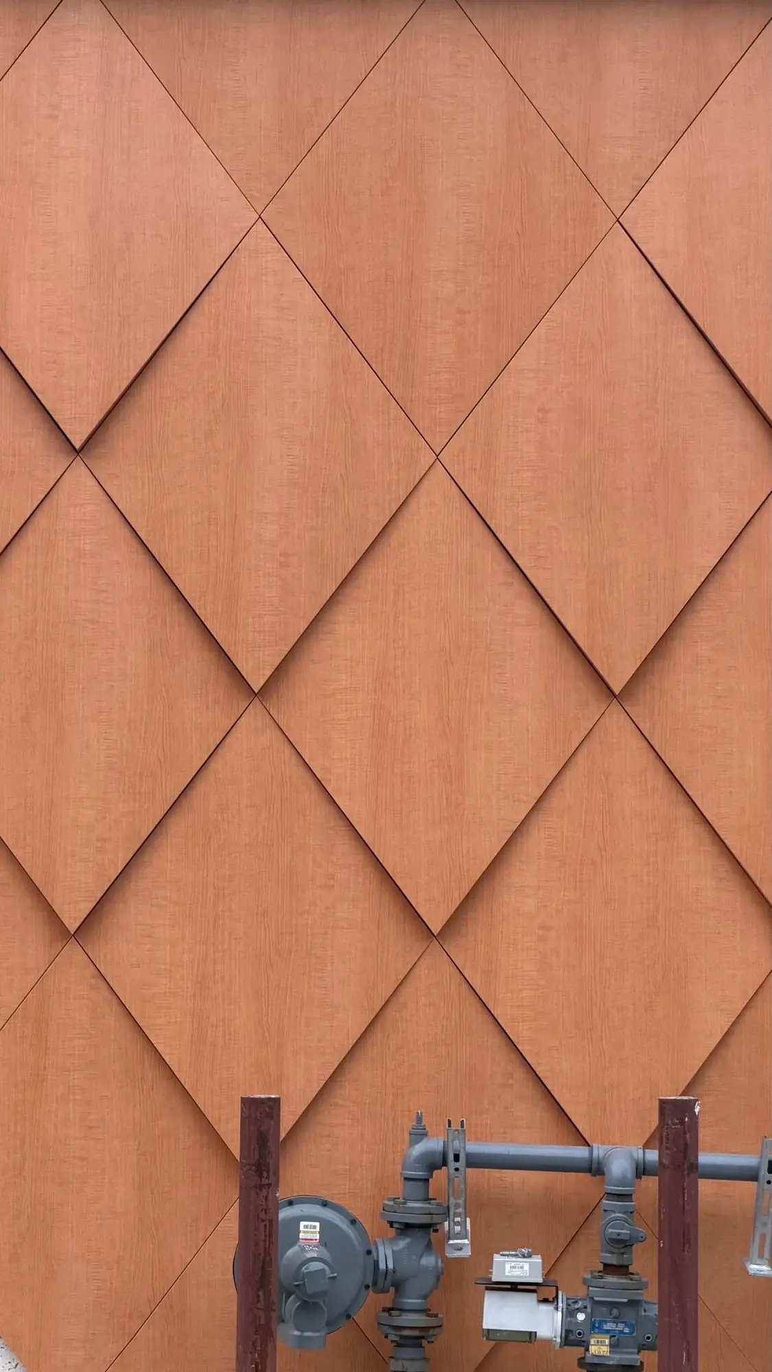 Close view of wood-look ACM diamond panels with precise joints, Boston